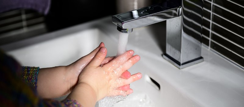 Girl washing hands - Image credit: Richard Bulley