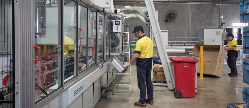 Workers at a Canola production factory at MSM Milling in Manildra