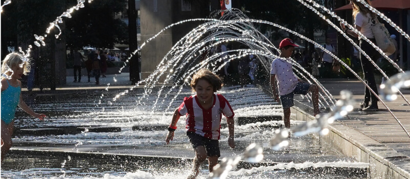 Children playing in the water at Darling Harbour, NSW. 