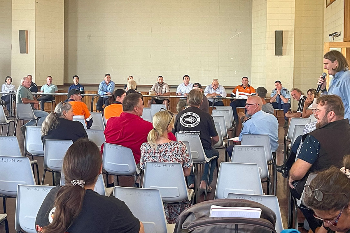 Town Hall style engagement session with person on microphone off to the right 