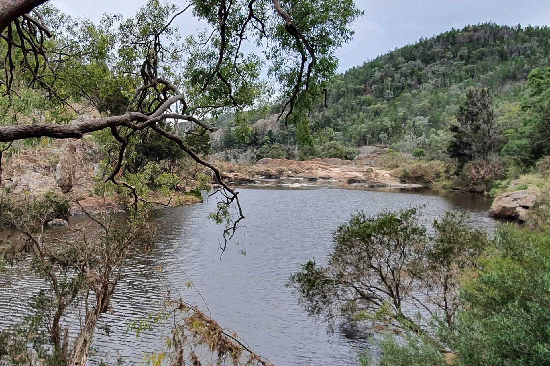 The Severn River surrounded by rocky banks and tree covered hills