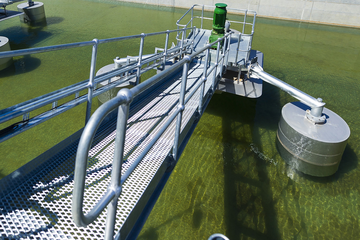 silver bridge and machinery in water filled container